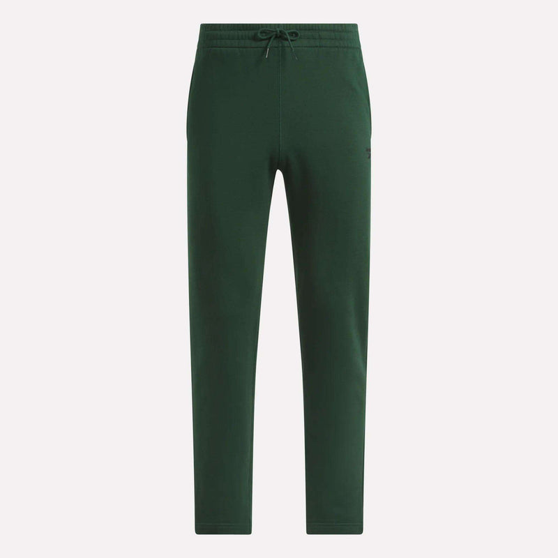Dark green Men’s Open Hem Pants by Reebok, designed for a relaxed look with a drawstring waistband, side pockets, and tapered legs with open hems, displayed against a plain white background.