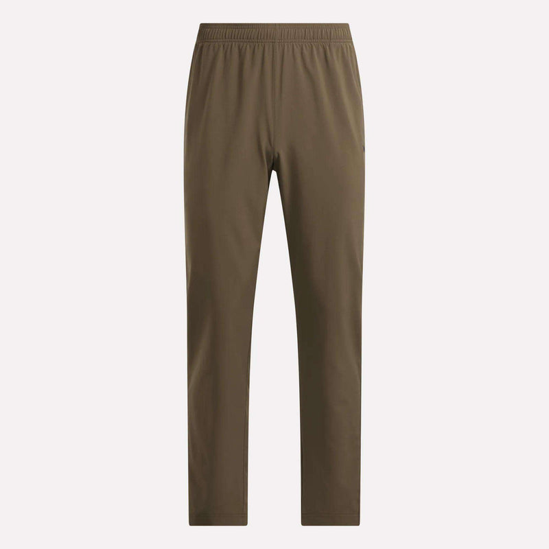 Reebok Men’s Woven Training Pants feature an elastic waistband and straight legs without visible pockets or extra detailing, shown against a plain light background—perfect for those looking for comfortable men’s workout pants.