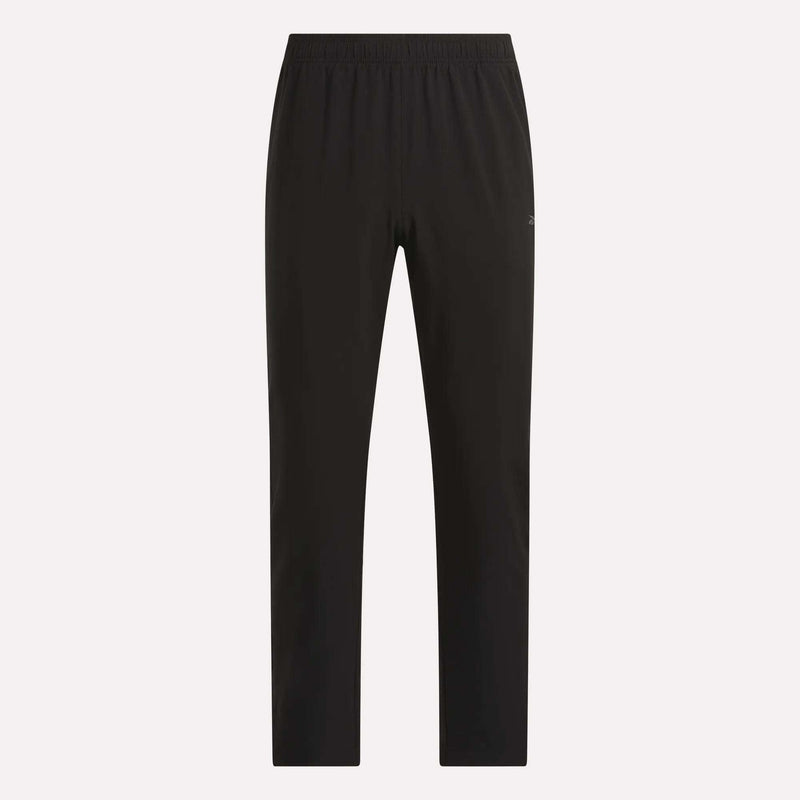 The Reebok Men’s Woven Training Pants feature an elastic waistband, straight-leg silhouette, and a minimal design, showcased against a plain light background.