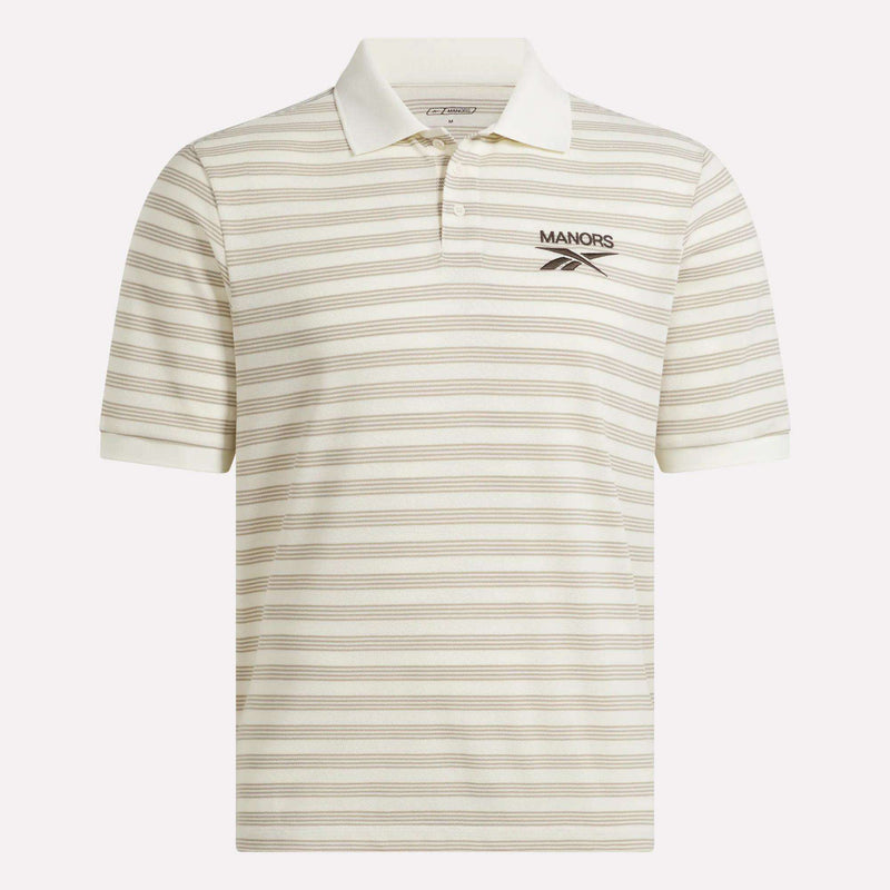 The Reebok x Manors Men’s Pique Polo is a cream-colored short-sleeve golf shirt with thin horizontal beige stripes and a small MANORS logo on the left chest. This classic men’s polo from Reebok features a traditional collar and button placket, blending style and comfort on the course.
