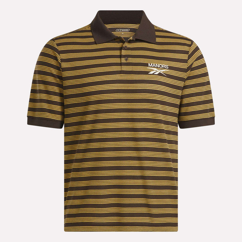 The Reebok x Manors Men’s Pique Polo is a brown short-sleeve golf shirt featuring thin horizontal yellow stripes, a classic collar, and a button placket. White MANORS and Reebok logos are displayed on the left chest, highlighting this exclusive collaboration—a stylish men’s golf polo from Reebok that’s perfect both on and off the course.