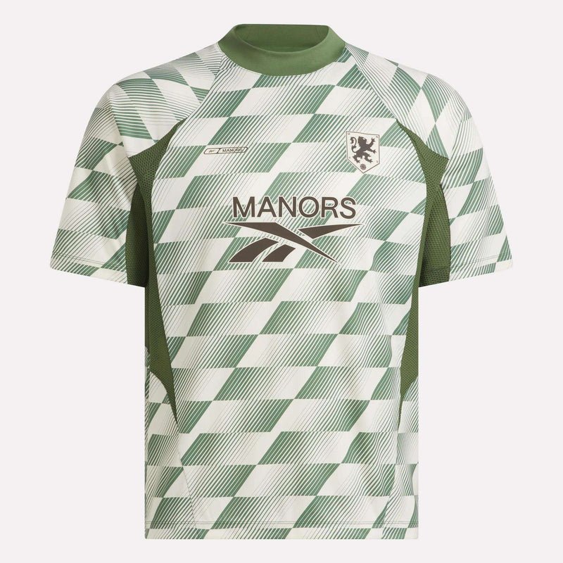 Introducing the Reebok x Manors Men’s Mockneck Polo: a green and white short-sleeve sports jersey featuring a diagonal checker pattern, green collar, MANORS branding and logo on the front, and a small lion crest on the left chest. Designed in collaboration with Reebok and Manors, this jersey is crafted from performance stretch fabric for exceptional comfort and mobility during play.