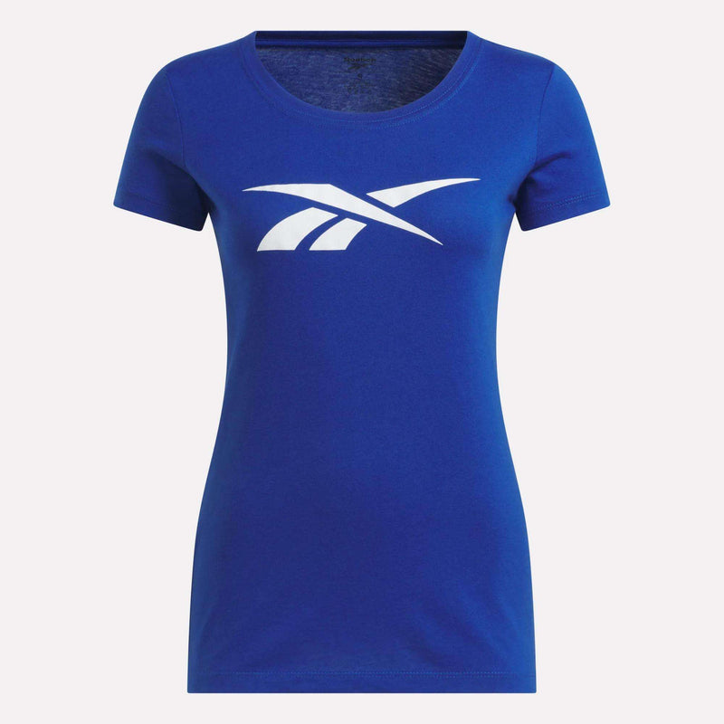 The Women’s Logo Tee by Reebok is a blue, short-sleeved t-shirt featuring a white Reebok logo on the chest, shown against a plain light background.