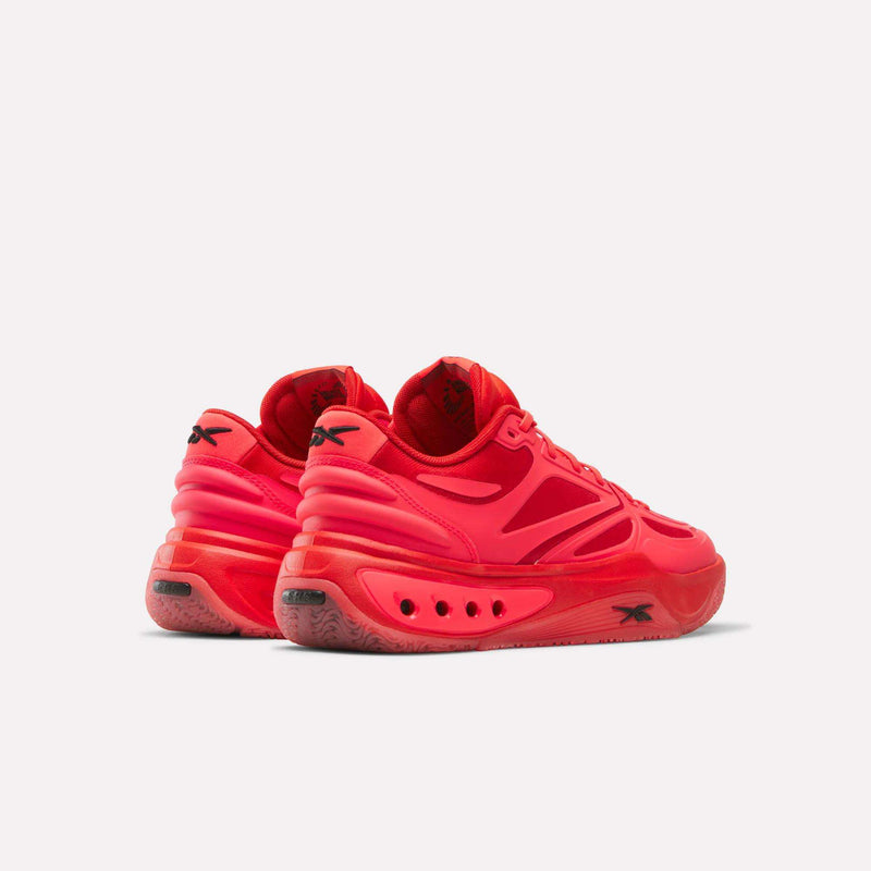 Bright red Reebok Engine A basketball shoes shown from a rear angle, featuring a chunky midsole with ERS technology and circular cutouts.