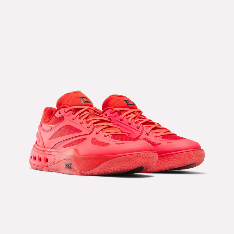 Pair of bright red Reebok Engine A Basketball Shoes with mesh uppers and textured rubber soles featuring ERS technology.