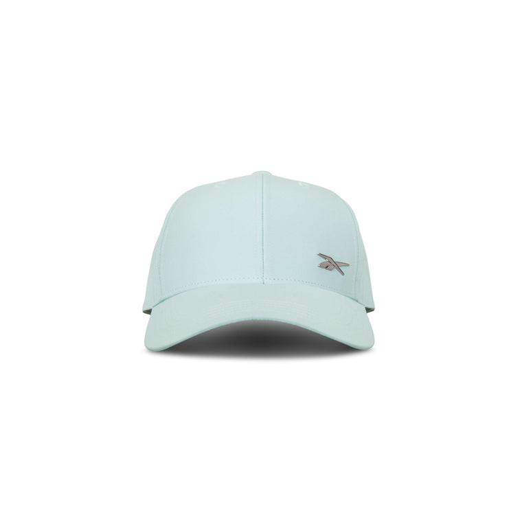 The Reebok Badge Cap in light blue features a curved brim, small embroidered front-left logo, and a Speedwick sweatband for moisture-wicking comfort. Shown facing forward on a white background.