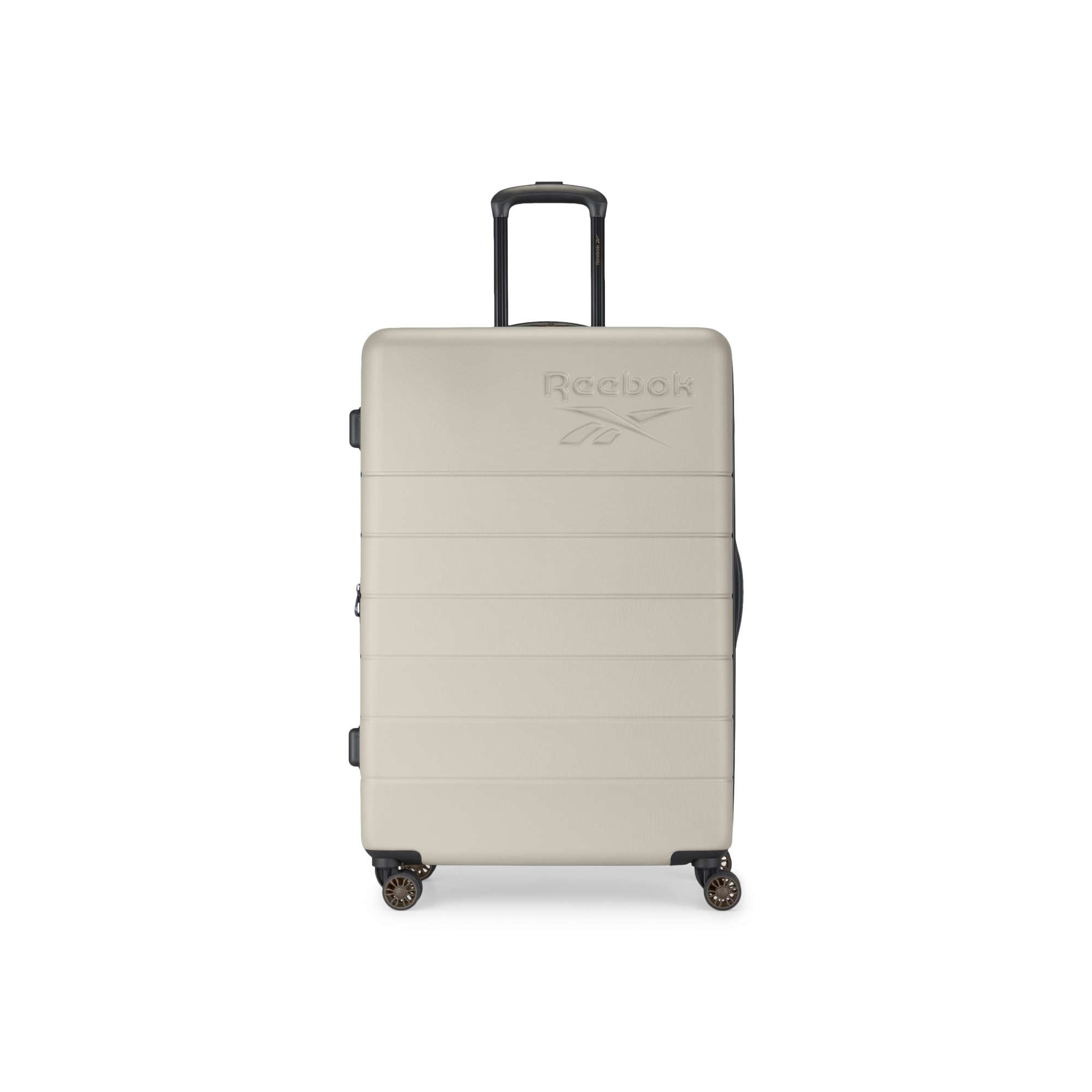A beige Reebok Captain 2 Piece Luggage Set hard-shell suitcase, featuring four spinner wheels, a black telescopic handle, and an embossed logo on the front, stands upright against a white background.