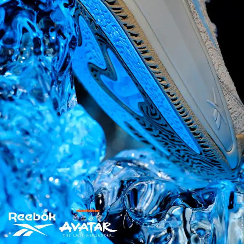 Reebok x Avatar Club C 85 low-top sneakers with a textured grey upper and a blue translucent sole stepping into splashing water.