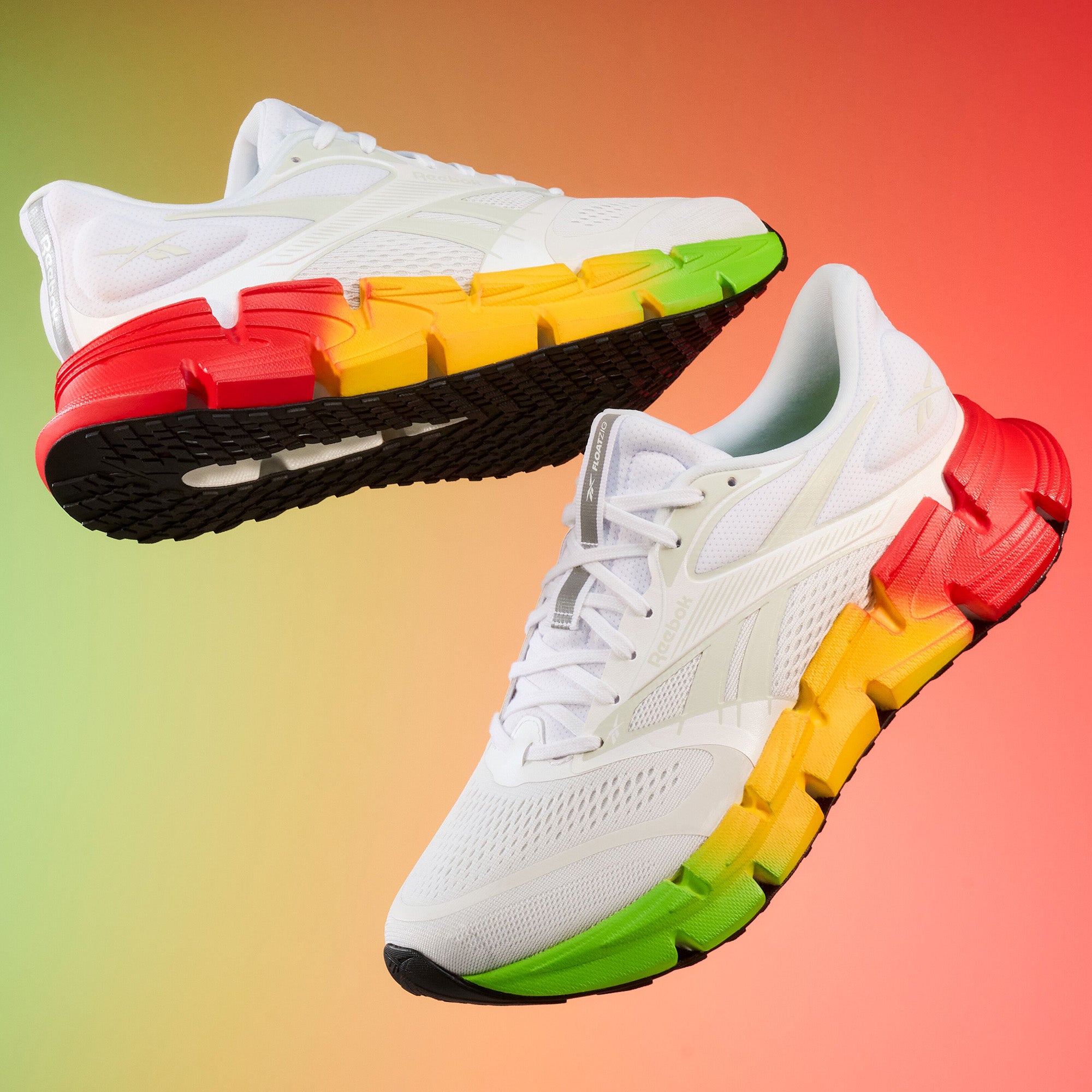 White sneakers with colorful sole on a gradient background
