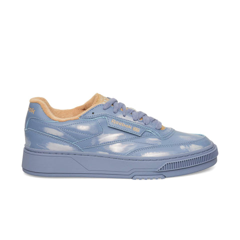 Glossy Hazy Blue Club C LTD low-top sneaker featuring a camel interior lining and matching blue laces, styled as a casualwear lifestyle classic.