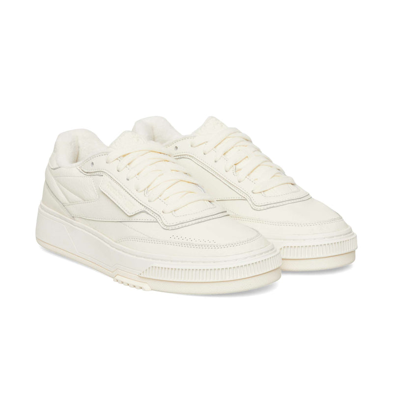Off-white Reebok Club C LTD low-top sneaker with matching laces and a chunky ribbed sole.