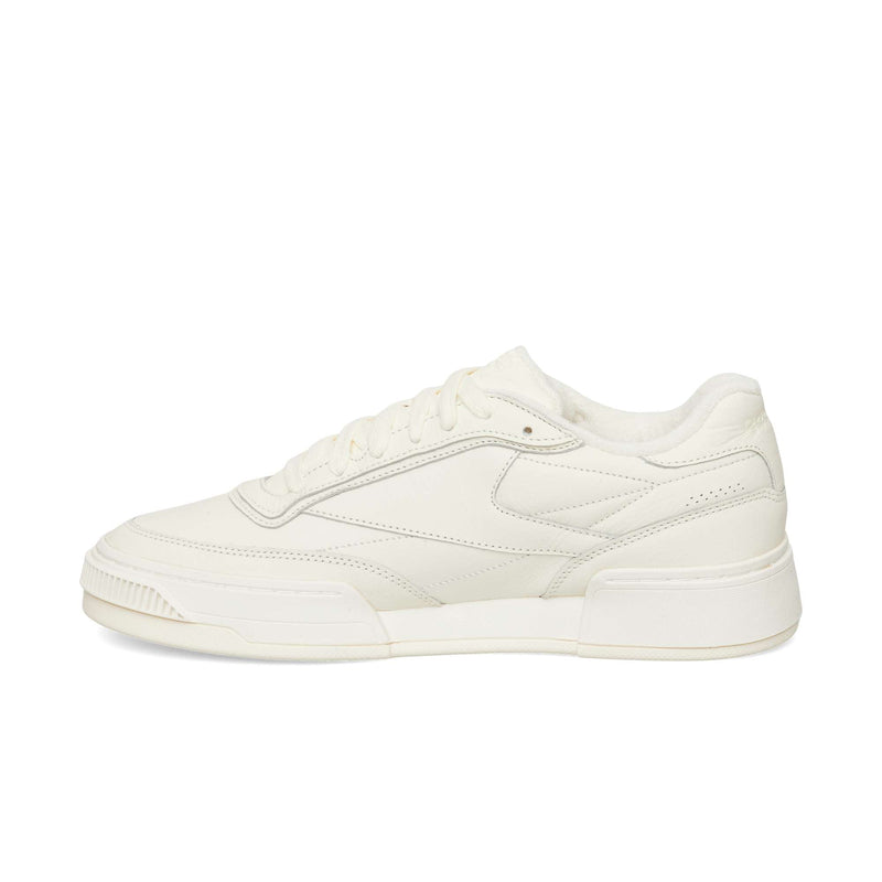 Off-white Reebok Club C LTD low-top sneaker with a textured sole and lace-up closure.