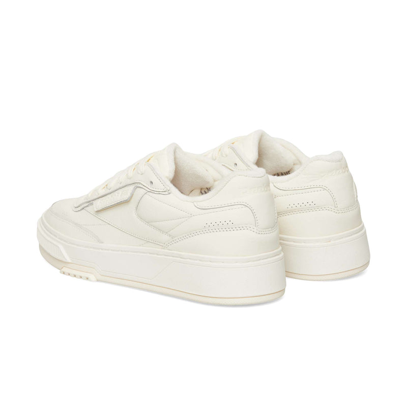 Off-white Reebok Club C LTD low-top sneakers with a chunky sole, viewed from the rear three-quarter angle.