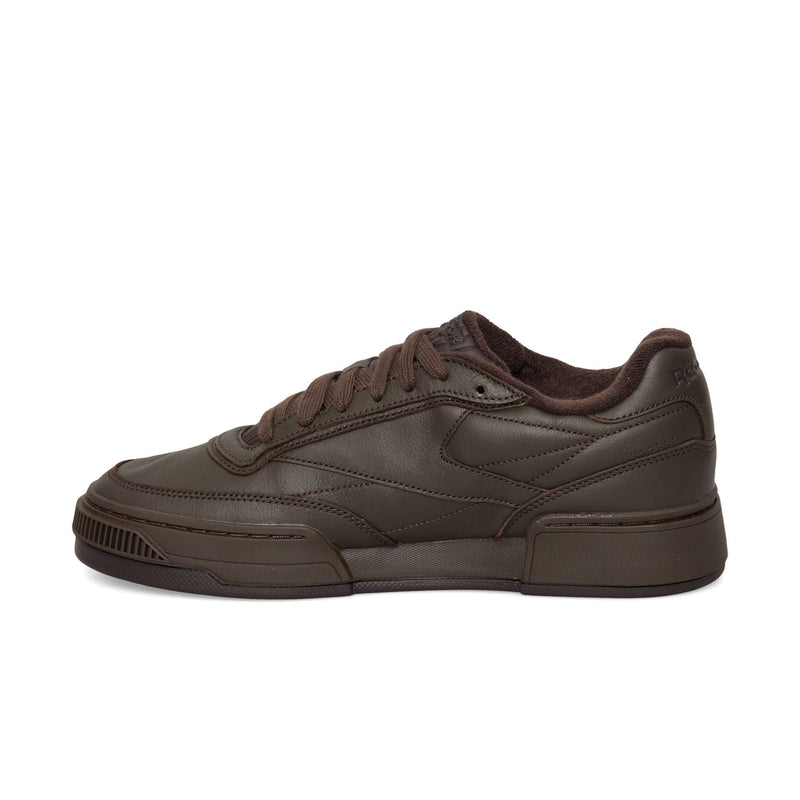 Dark brown Reebok Club C LTD low-top sneaker with matching laces and a textured rubber sole.