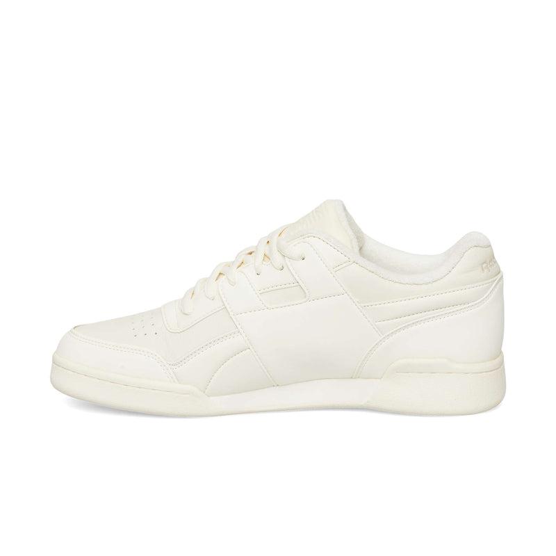 Off-white Reebok Workout Plus OG sneakers with a classic silhouette, featuring a flat rubber sole and matching laces.
