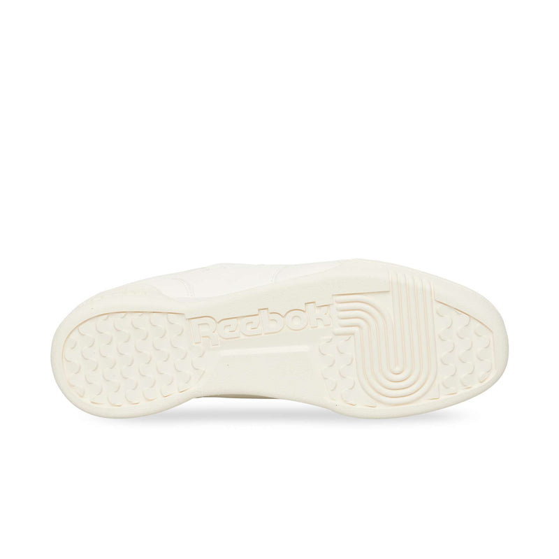 Off-white outsole of a Reebok Workout Plus OG sneaker with a textured grip pattern and a central logo.