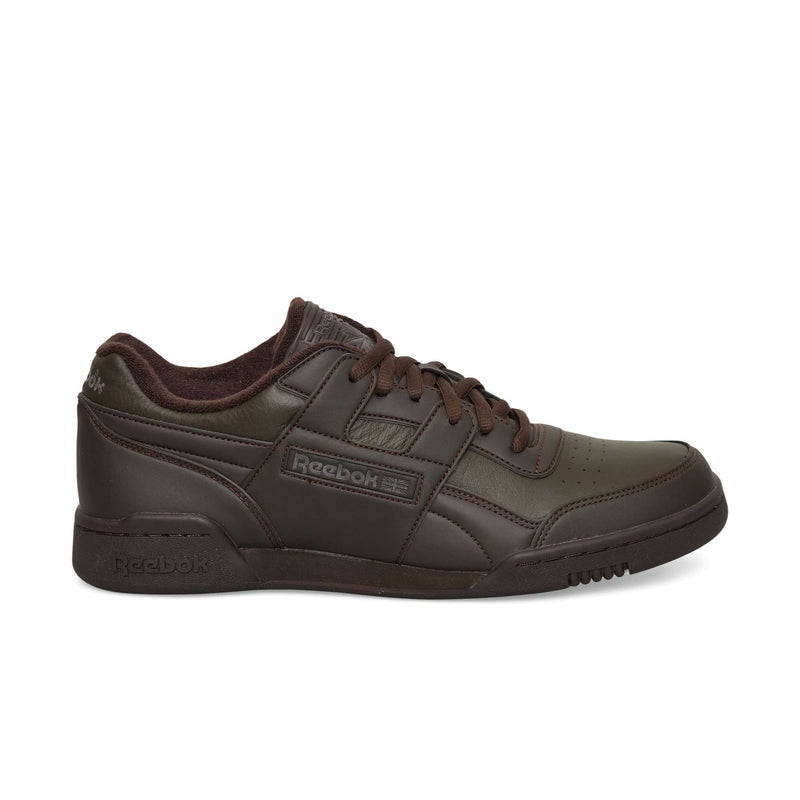 Dark brown Reebok Workout Plus OG sneakers with a classic silhouette, matching laces, and a textured rubber sole.
