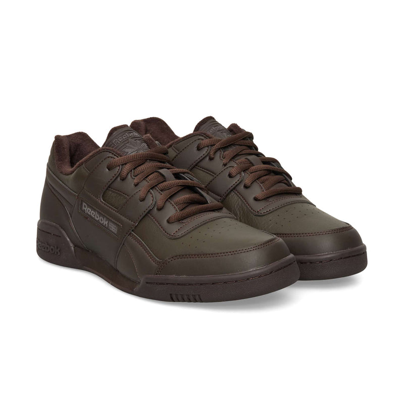 Pair of dark brown Reebok Workout Plus OG low-top sneakers with laces and textured collars.