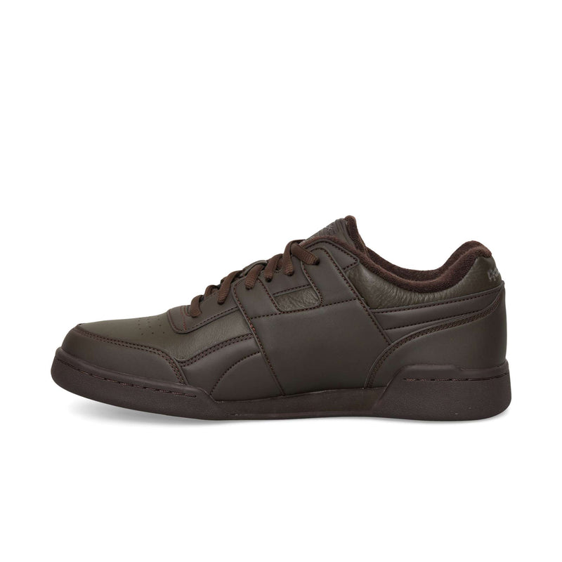 Dark brown Reebok Workout Plus OG sneakers featuring a classic silhouette, matching laces, and a textured collar.