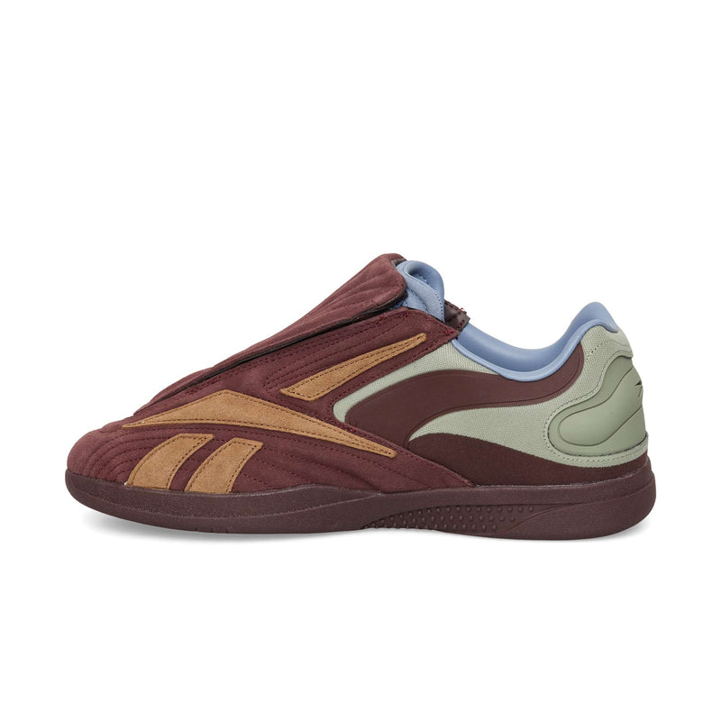 Reebok Hammer Pro LTD slip-on sneakers in burgundy, tan, and light green with a blue interior collar and a durable rubber sole.