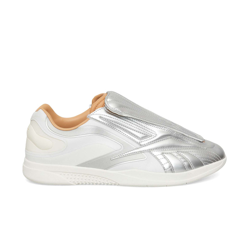 Silver metallic Hammer Pro LTD sneakers featuring a laceless shroud, a durable white rubber sole, and a camel tan interior lining.