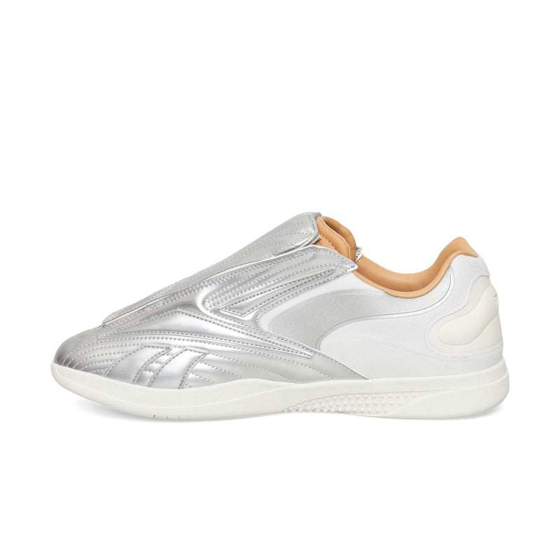 Silver Reebok Hammer Pro LTD slip-on sneakers with a tan inner lining and a white textured rubber sole.