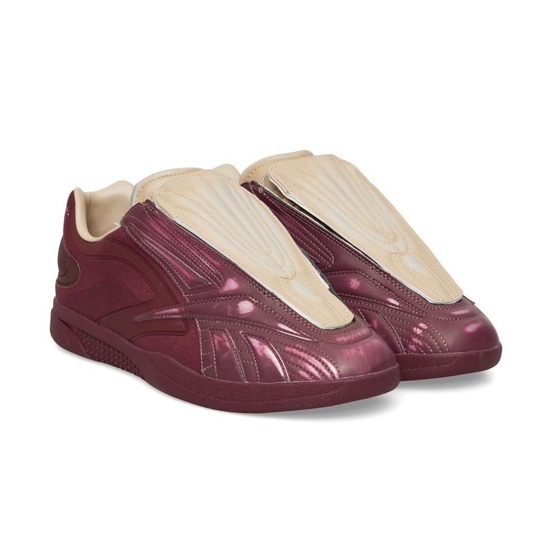 Maroon Reebok Hammer Pro LTD low-top sneakers with a glossy finish, beige textured lace cover, and a durable rubber sole.