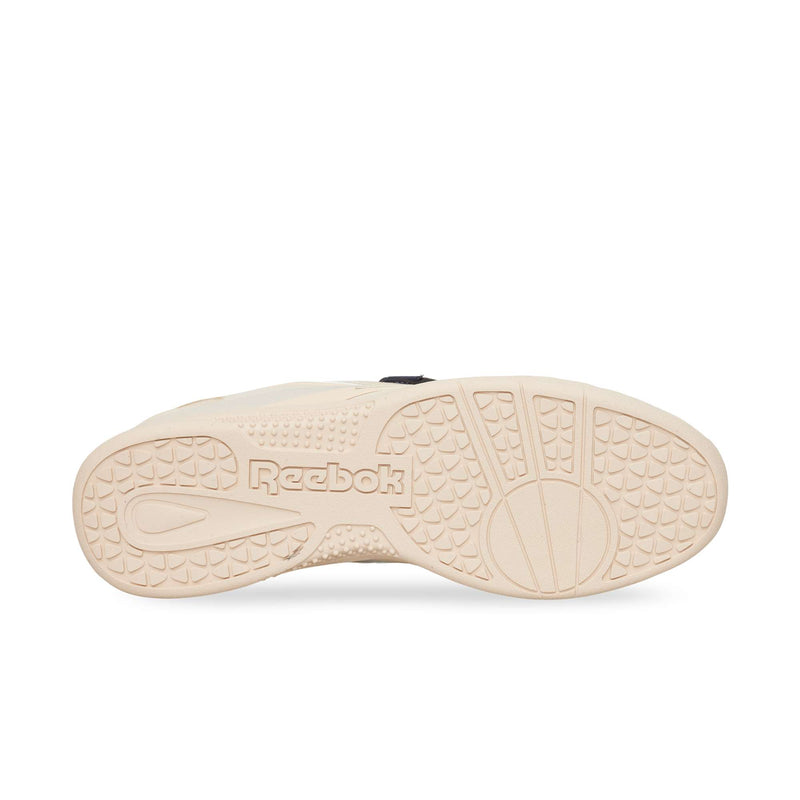 Beige rubber outsole of a Reebok Hammer Pro LTD sneaker, featuring a circular pivot point and geometric tread pattern.