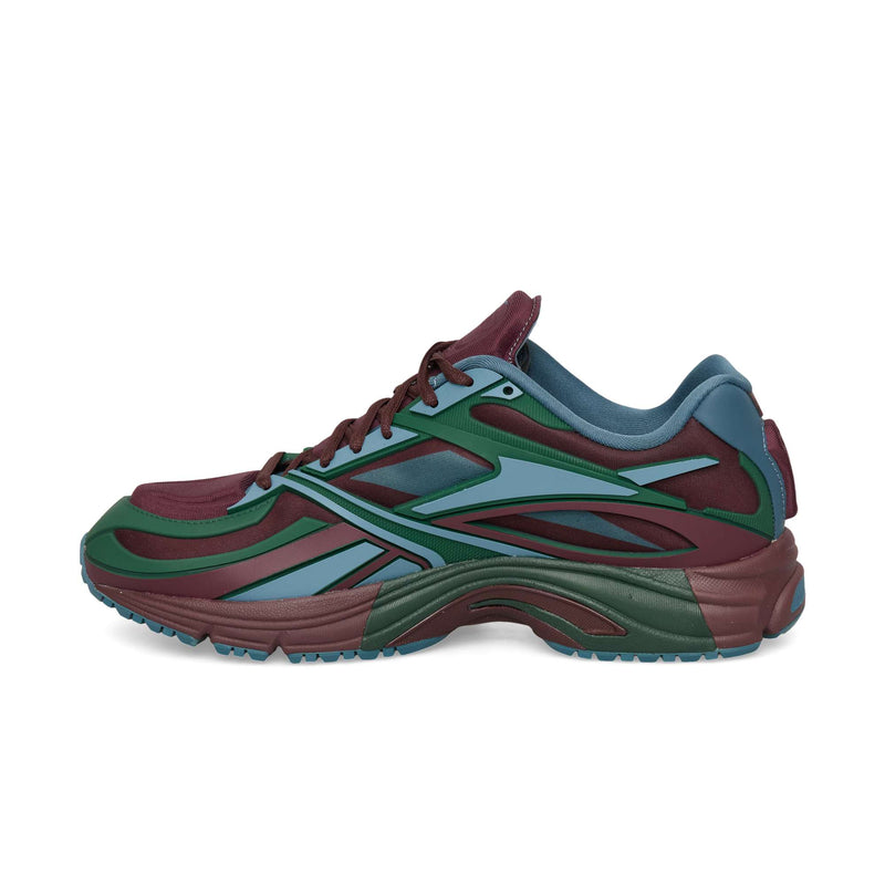 Reebok Premier Road Modern low-top sneaker featuring a mesh and synthetic paneled upper in burgundy, teal, and green with a chunky rubber sole.