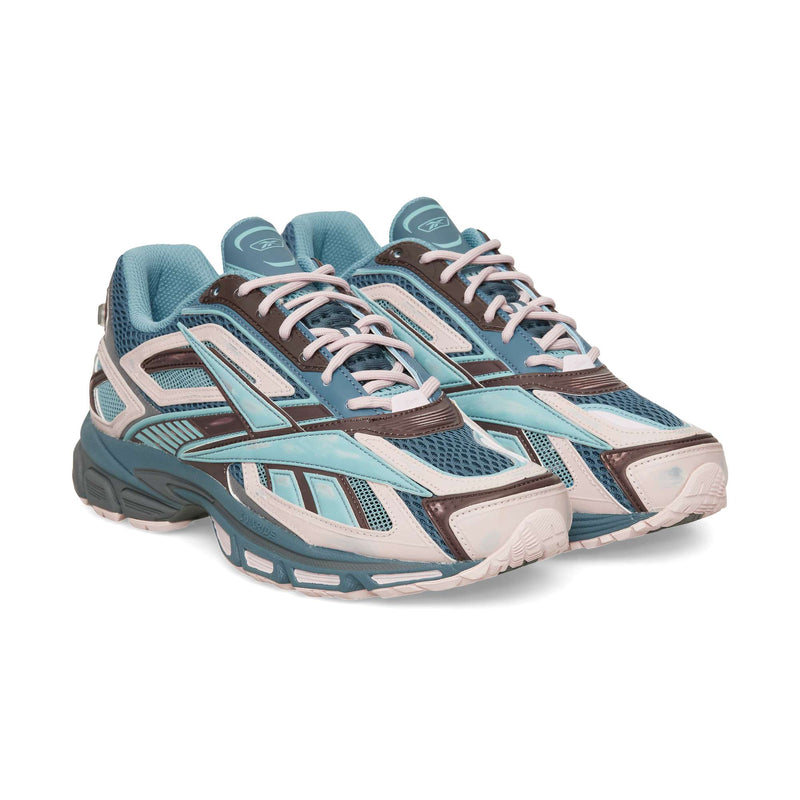 Reebok Premier Road Ultra low-top running sneaker in blue, brown, and cream with mesh panels, light-colored laces, and a thick, dual-density midsole.