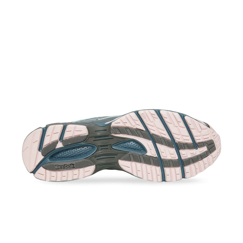 The lugged tread of a Reebok Premier Road Ultra running shoe featuring a light pink and dark grey pattern.