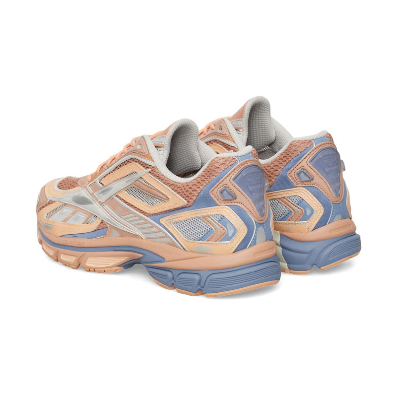 Reebok Premier Road Ultra chunky running shoes in peach and light blue, featuring mesh panels, a dual-density midsole, and metallic silver side detailing.
