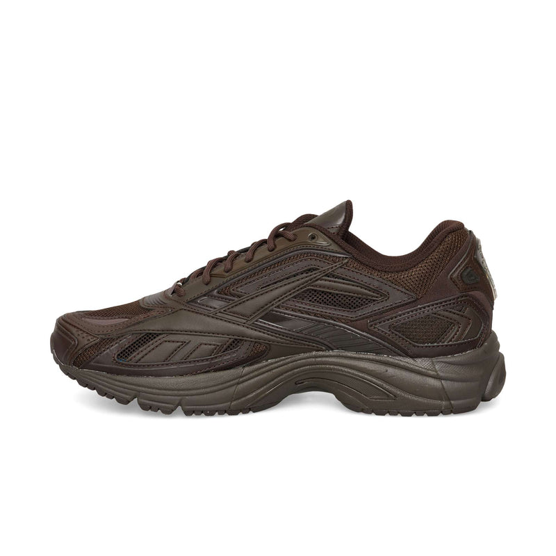 Dark brown Reebok Premier Road Ultra low-top sneaker featuring mesh panels and a thick, dual-density midsole.