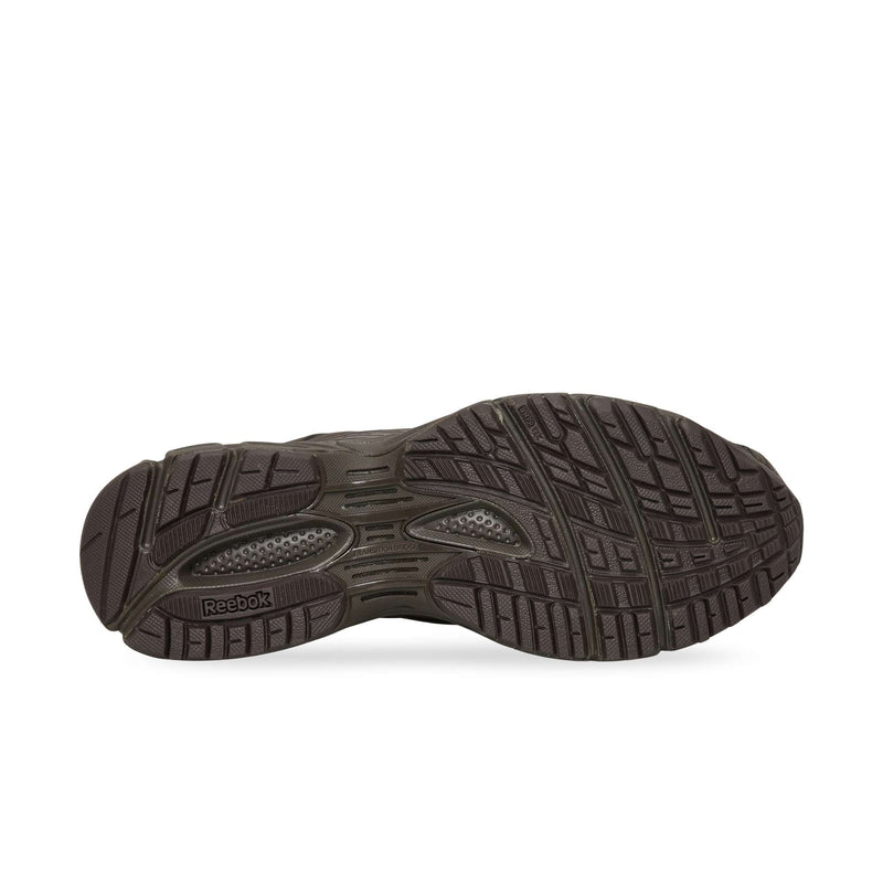 Bottom view of a dark brown Reebok Premier Road Ultra sole with a textured tread pattern.