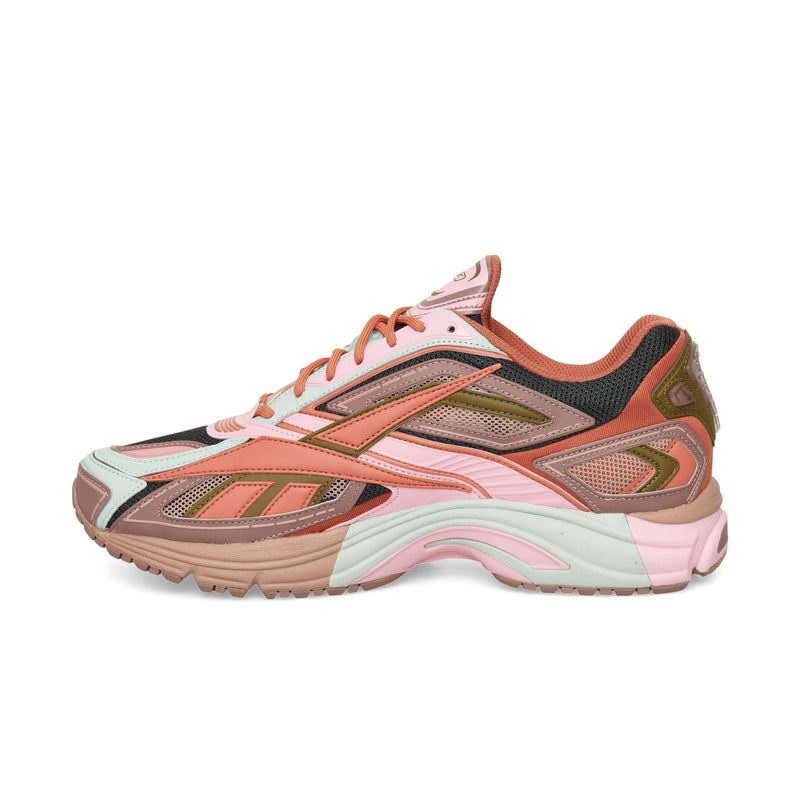 Reebok Premier Road Ultra running shoe in shades of pink, brown, and light blue with mesh panels and a chunky dual-density midsole.
