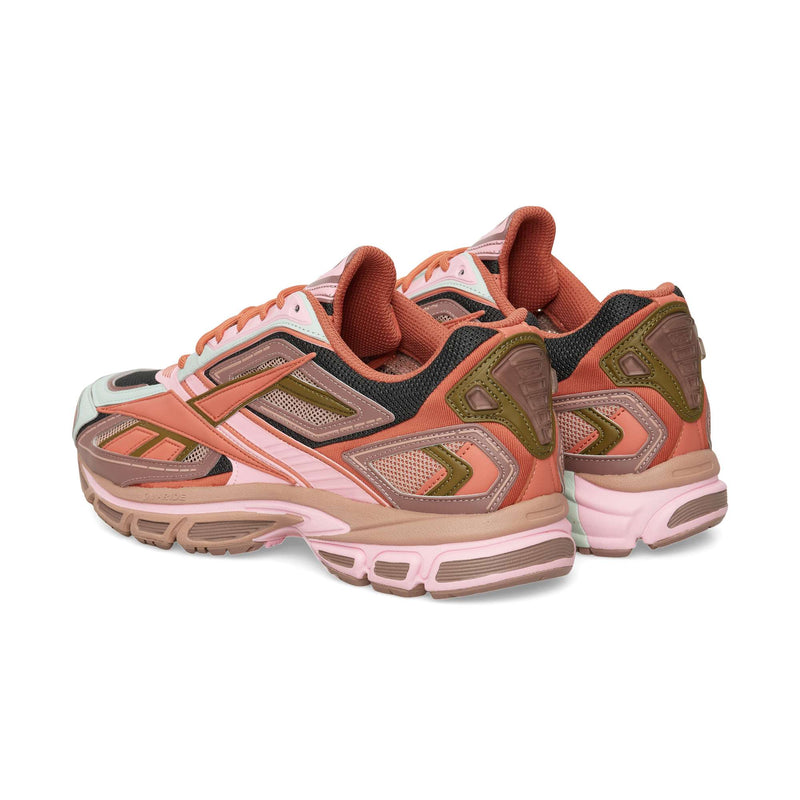 Two Reebok Premier Road Ultra running shoes in shades of pink, orange, and olive green, viewed from the rear three-quarter angle.