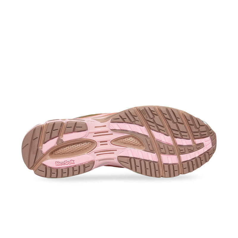 The pink and brown rubber outsole of a Reebok Premier Road Ultra running shoe with a textured tread pattern.