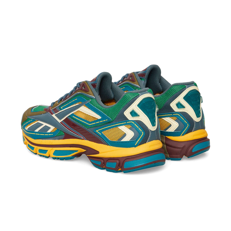 A rear three-quarter view of multi-colored Reebok Premier Road Ultra running sneakers, featuring mesh and synthetic overlays over a dual-density midsole.