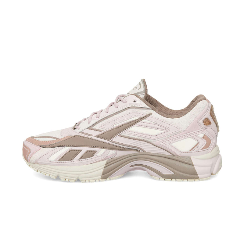Pale pink and taupe Reebok Premier Road Ultra running sneaker featuring a layered design and a thick, dual-density midsole.