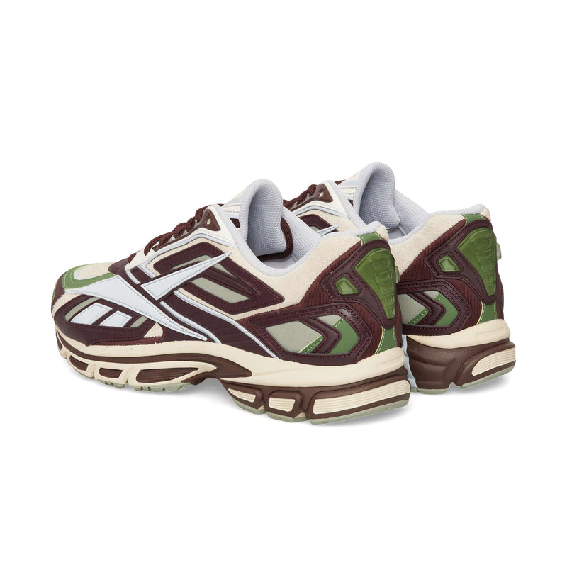 Reebok Premier Road Ultra low-top running sneakers in maroon, beige, and olive green, featuring an archival running silhouette and a chunky, dual-density midsole.