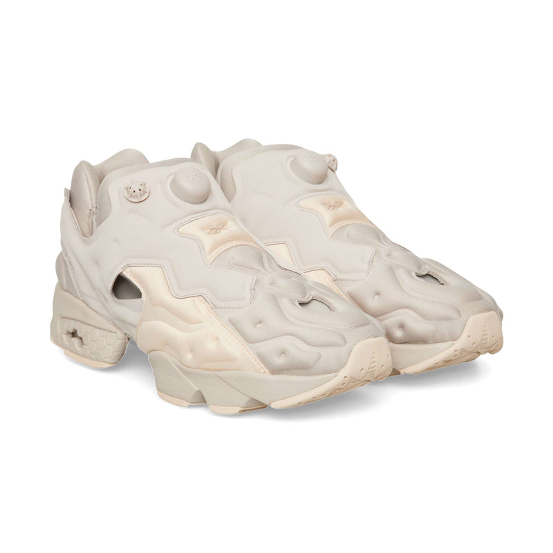 Beige Reebok Instapump Sliver slip-on athletic shoe with an air pump system on the tongue and a chunky, segmented sole.