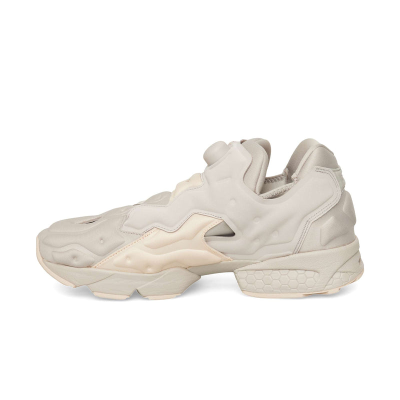Beige Reebok Instapump Sliver slip-on athletic shoe with a pump mechanism on the tongue and a chunky, segmented Hexalite cushioning sole.