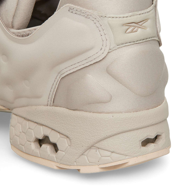 Close-up of the heel of a beige Reebok Instapump Sliver sneaker with a sculpted, Hexalite cushioning honeycomb-textured sole.