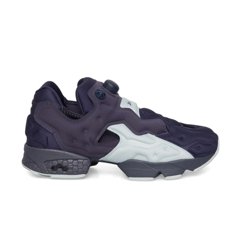 Dark indigo and breeze Reebok Instapump Sliver athletic shoe with a pump mechanism on the tongue and a chunky, segmented sole featuring Hexalite cushioning.