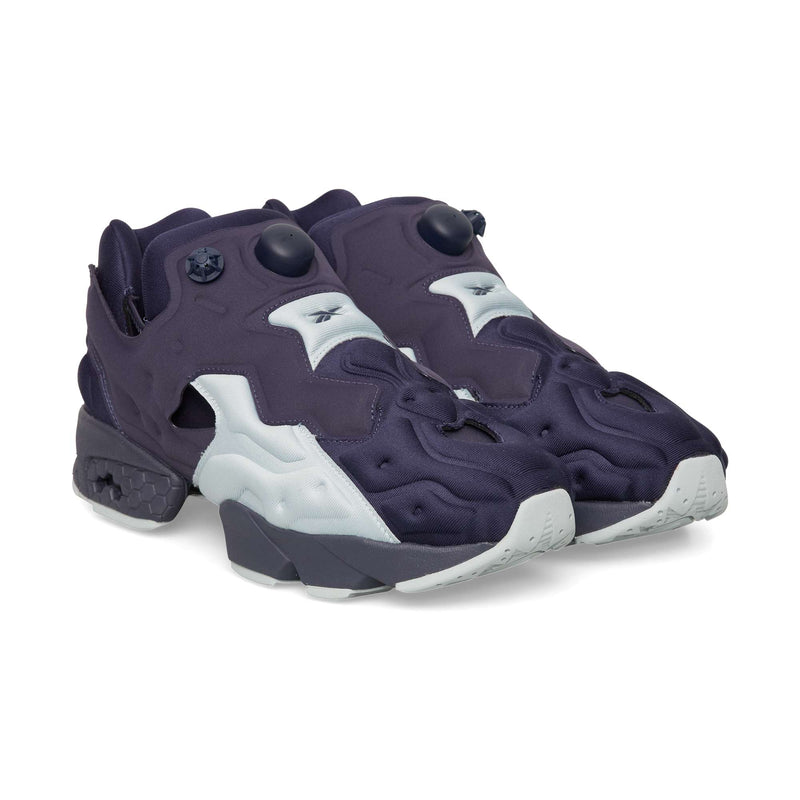 Dark purple Reebok Instapump Sliver slip-on sneakers featuring a tongue-mounted pump mechanism and a chunky, two-toned grey and purple sole.