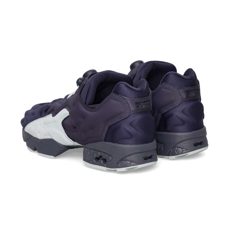 Two dark purple Reebok Instapump Sliver slip-on sneakers with white side overlays and a chunky, segmented sole providing Hexalite cushioning.