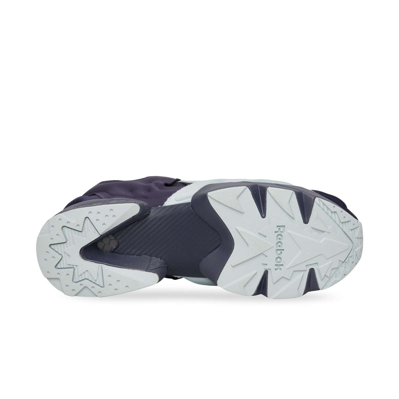 The bottom view of a Reebok Instapump Sliver sneaker showing a segmented light gray and navy blue patterned rubber outsole with the brand name embossed in the center.