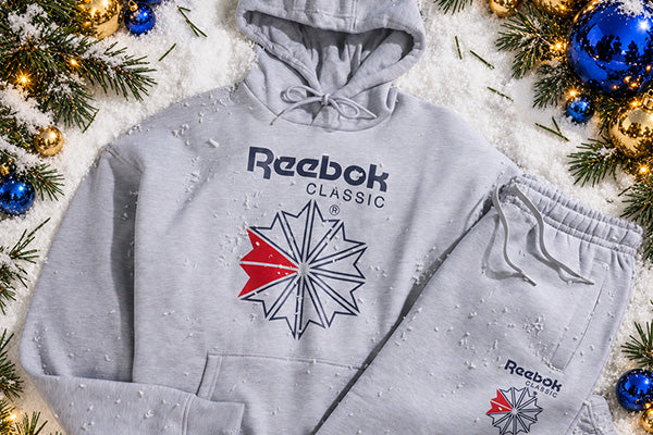 gray reebok hoodie  and sweat pants in snow