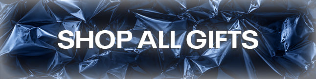 A promotional banner with the text 'SHOP ALL GIFTS' in bold white capital letters over a dark blue crumpled plastic background.