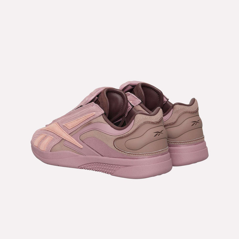 Two mauve and pink Reebok Hammer Pro LTD Shoes are placed back-to-back on a plain white background, displaying side and rear views that highlight their layered design details, suede uppers, durable rubber soles, and subtle branding on the heels.